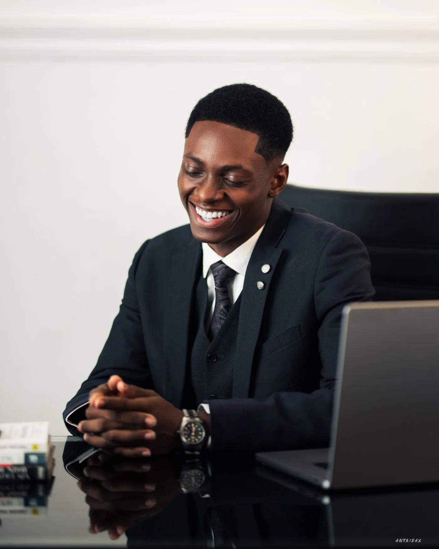 Jerry Onwuka smiling at his desk